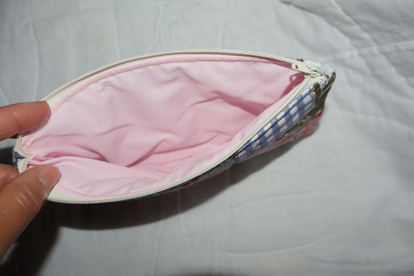 close up of a pink inner fabric on a pouch