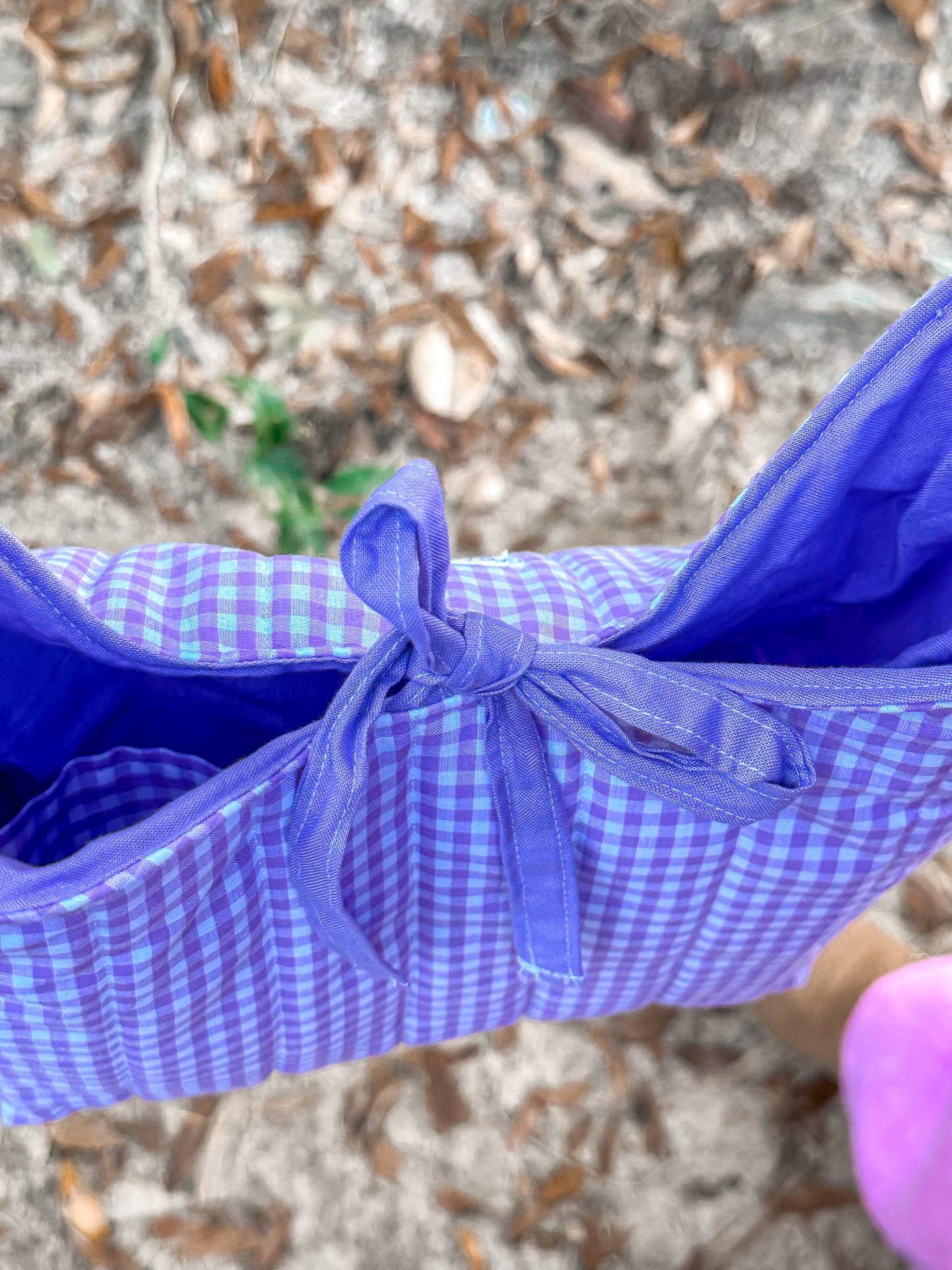 close up of the purple tie closure on the bag