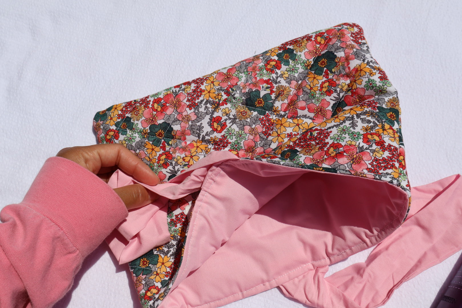 close up of a pink inner fabric on a floral bible/book sleeve