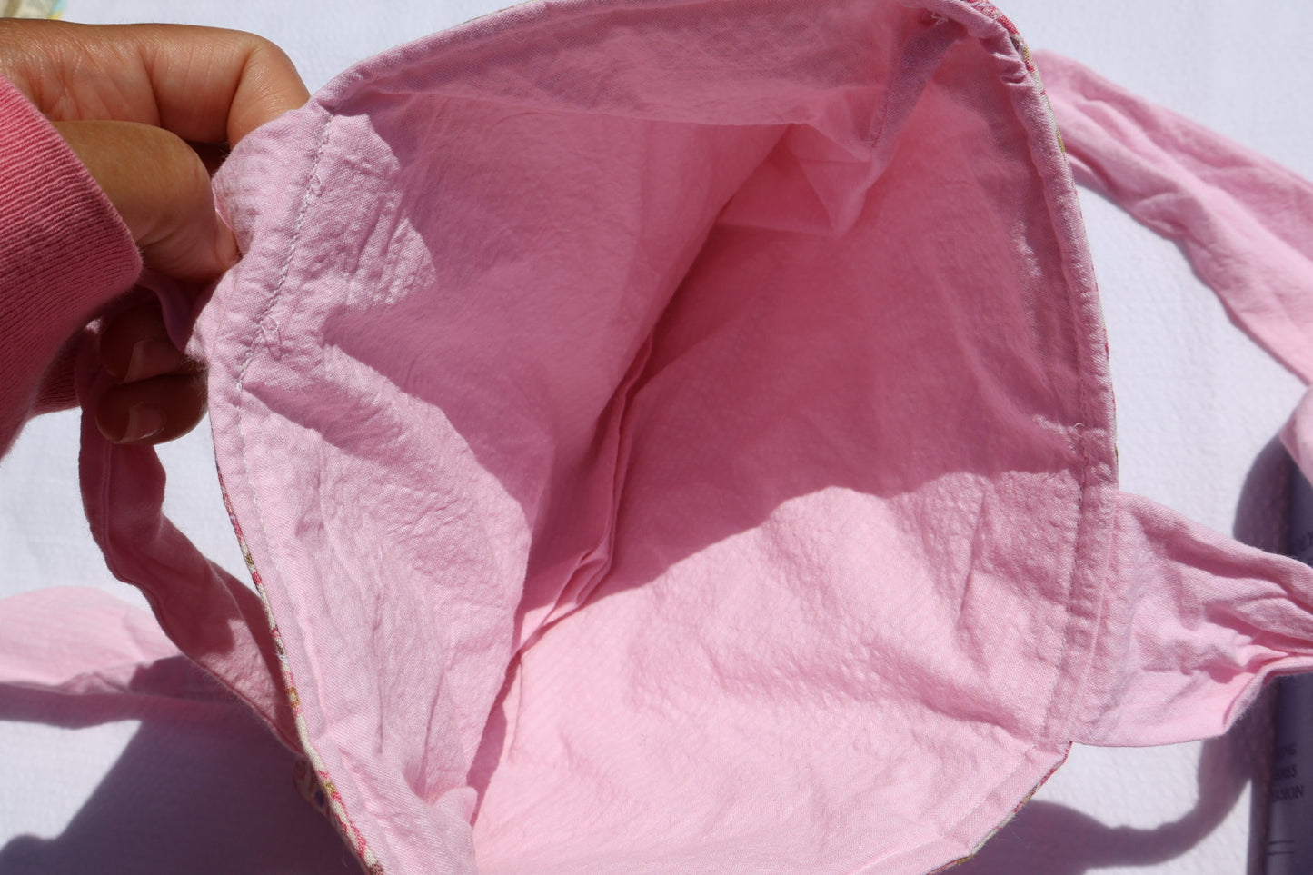 close up of a bible/book sleeve's pink inner fabric