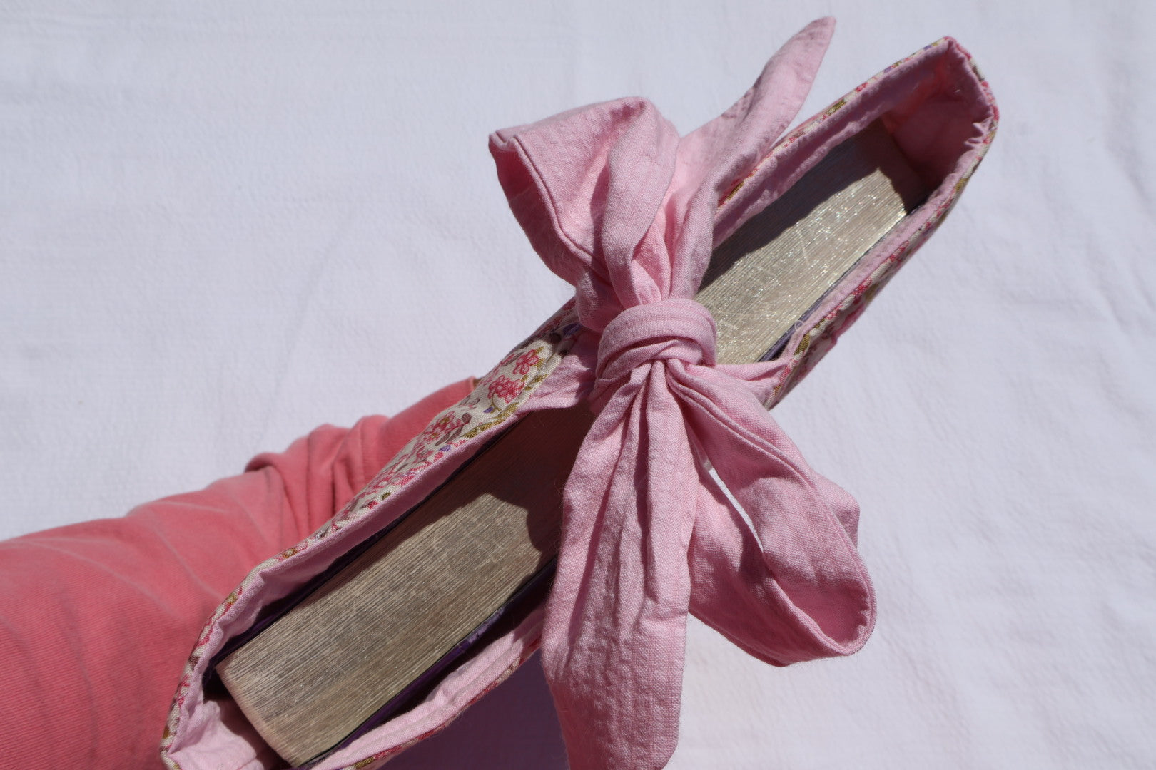 close up a bible displayed in a bible/book sleeve