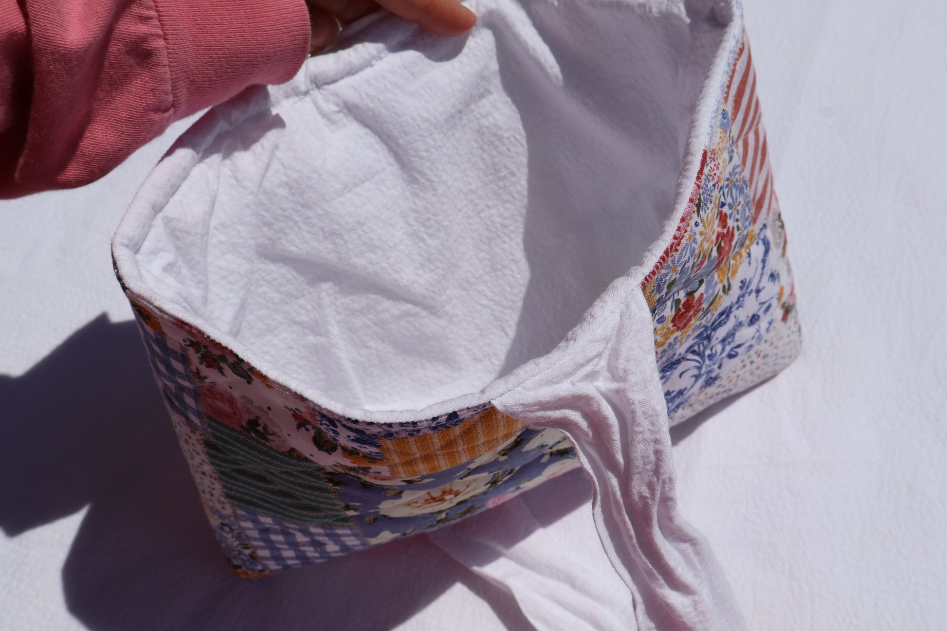 close up of a bible/book sleeve showing the inner white fabric