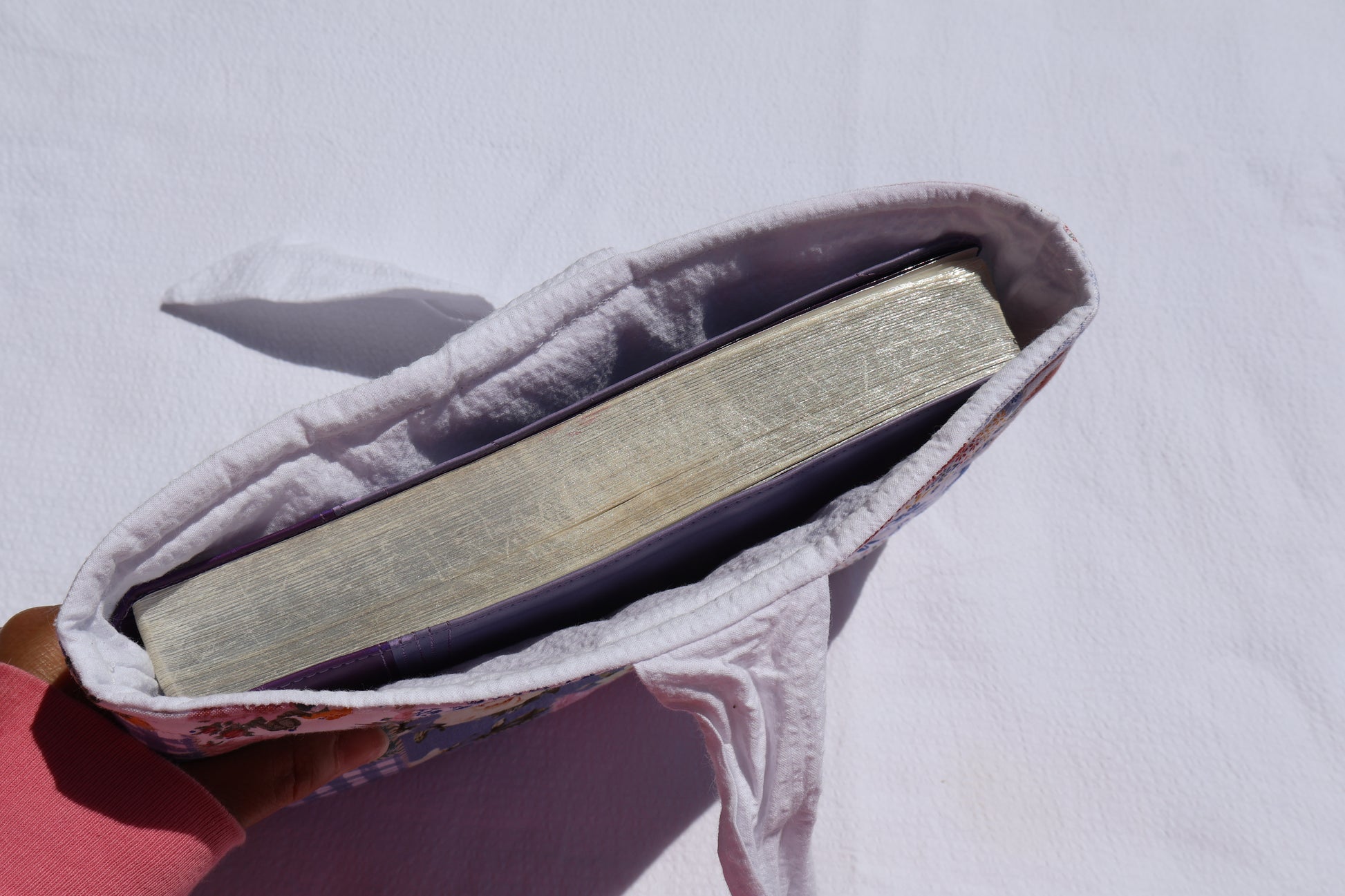 bible displayed inside the bible/book sleeve. while inner fabric