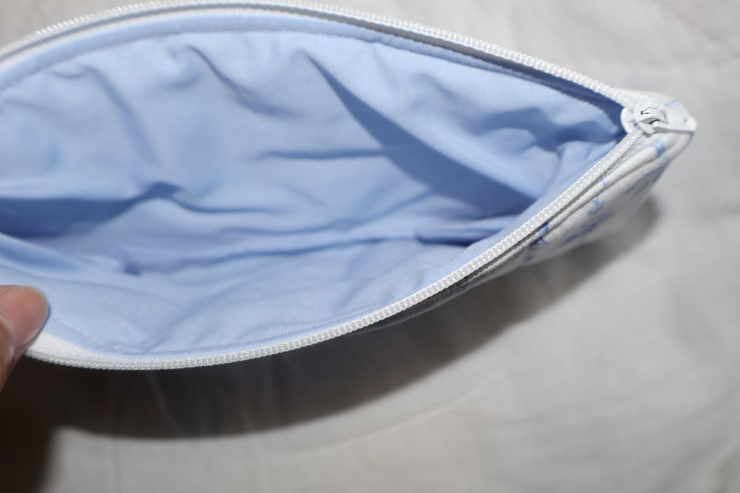 close up of inner fabric that is blue on a pencil pouch