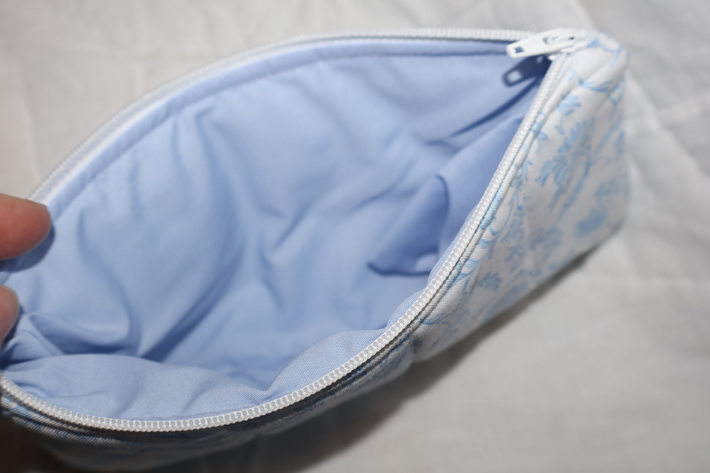 close up of a pencil pouch with a blue inner fabric